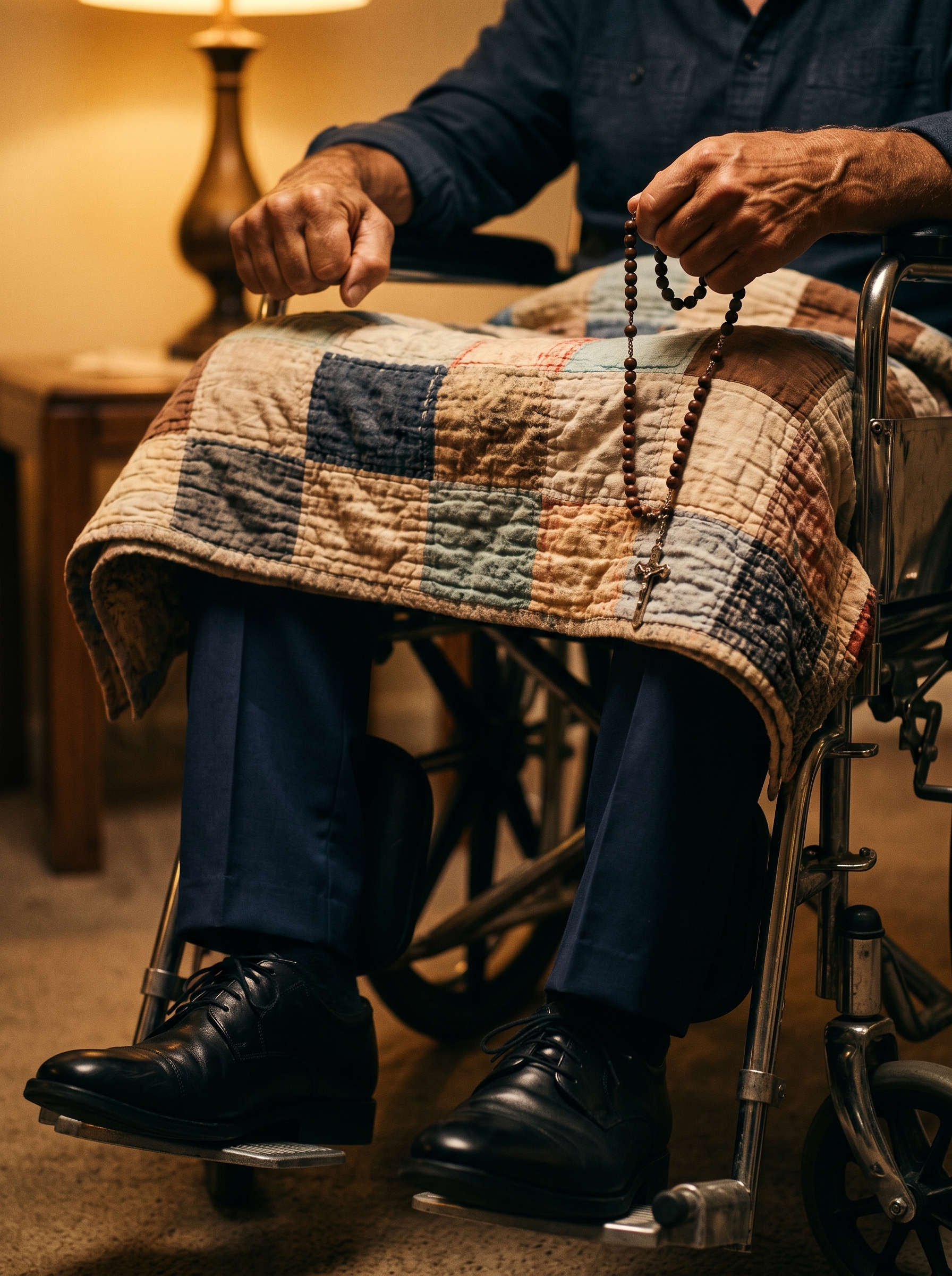 Flynn’s rosary draped over the quilt covering his legs and wheelchair