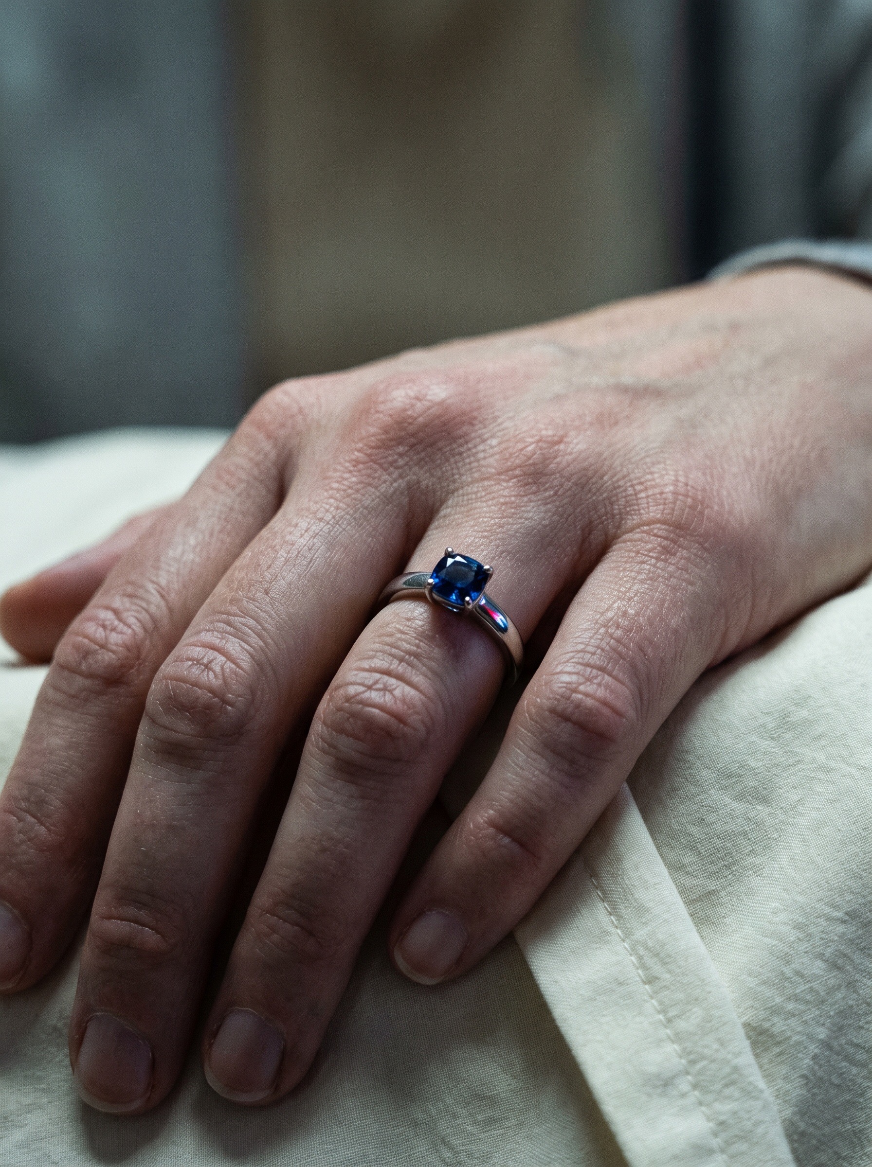Close view of the sapphire ring on Maria Garcia’s hand